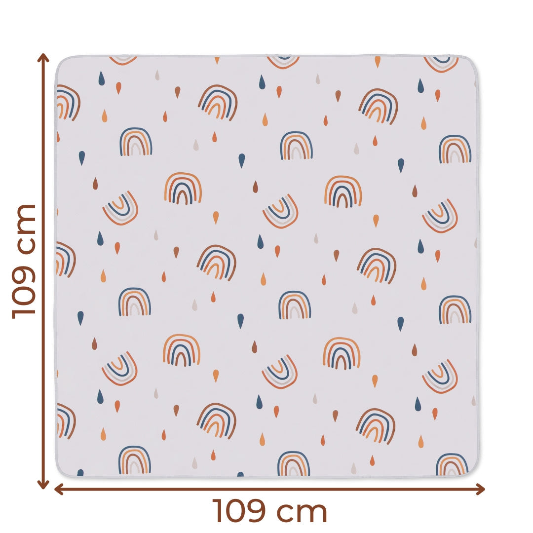 Square fabric splat mat with rainbow and raindrop pattern, water resistant floor cover