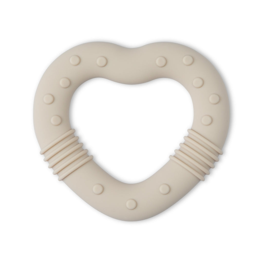 Heart-shaped beige silicone baby teether with textured bumps and ridges for soothing gums