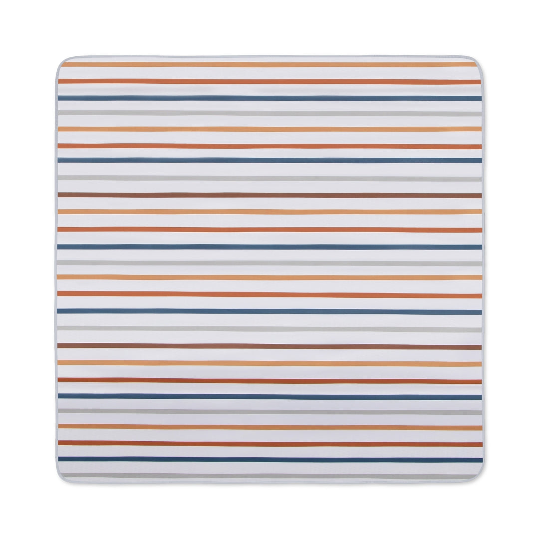 Striped changing pad cover on Splat Mat Messy Floor Cover, water resistant floor cover
